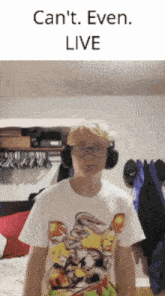 a boy wearing headphones and a looney tunes shirt says " can 't even live " above him