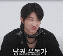 a young man is making a funny face in a video .