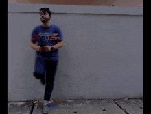 a blurry photo of a man with a shirt that says spiderman on it