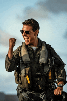 a man in a military uniform is wearing a watch that says rolex on it