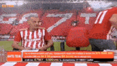a man in a striped shirt with the number 11 on the back