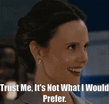 a woman is smiling with the words trust me it 's not what i would prefer