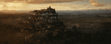 an aerial view of a castle on top of a hill