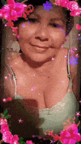 a woman is surrounded by pink flowers and sparkles