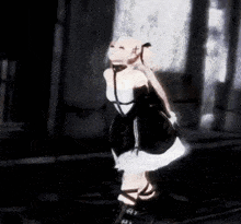 a woman in a black and white dress is standing in the dark