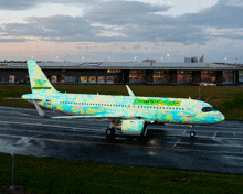 a colorful airplane with the word amsterdam on it