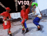a group of people are dancing in a video with the number v103 on the bottom .