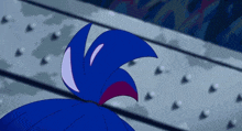 a close up of a person 's face with blue hair and red eyes with the letter m above her head