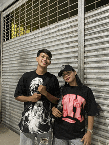 a man and a woman are standing next to each other wearing shirts that say worldwide