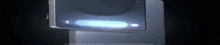 a close up of a cell phone with a blue light on the screen .