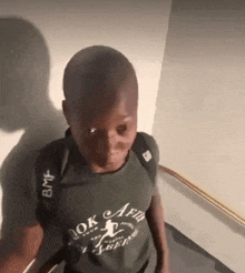 a boy wearing a shirt that says " ok affair " on it