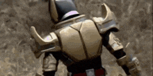 a close up of a person 's back with a helmet and armor .