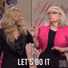 a woman in a pink jacket says let 's do it next to another woman