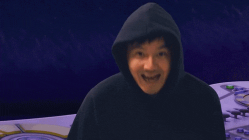 a man in a hooded sweatshirt says babye in white letters