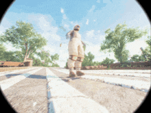 a person is standing on a skateboard on a street with trees in the background