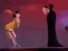 three cartoon characters are standing next to each other on a stage .
