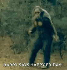 a man in a blue suit is dancing in the woods and says `` harry says happy friday ! ''