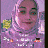 a woman wearing a pink hijab with red eyes and the words salam aidiladha dari anis