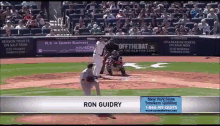a baseball game is being played and ron guidry is on the mound
