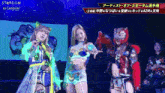 three women are standing on a stage with the word stardom on the bottom right
