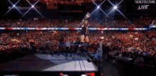 a wrestling match is being broadcast live on the nextblcthing app