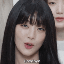 a close up of a woman 's face with the words " goodbye " below her
