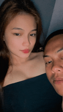 a man and a woman are posing for a photo together