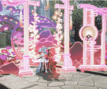 a couple standing in front of pink and purple pillars
