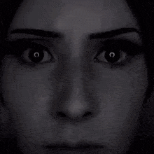 a close up of a woman 's face with a lightning bolt coming out of her eyes