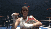 a woman in a boxing ring with a belt that says k-power
