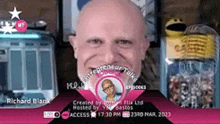 a man with a bald head is smiling in front of a sign that says entrepreneur talk