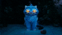 a blue monster with yellow eyes and sharp teeth is in a pool of water