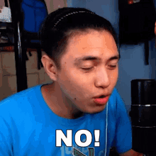 a man wearing a blue shirt says no