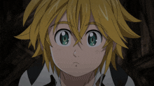 a close up of a cartoon character with yellow hair and green eyes