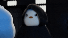 a penguin wearing a hooded cape with the words do it below it