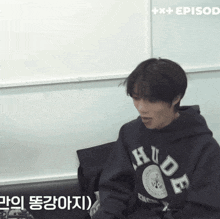 a person wearing a hoodie that says hude