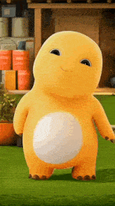 a yellow stuffed animal with a white belly is standing on a lush green field