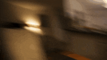 a blurry picture of a room with a light on