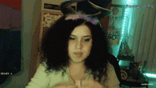 a girl wearing a headband that says happy halloween on it