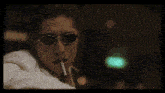 a blurry picture of a person 's face with a white shirt