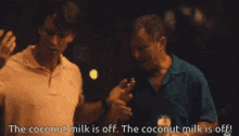 two men are standing next to each other and one of them says the coconut milk is off