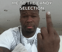 a man is giving the middle finger with the caption me to the candy selection