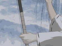 a person is holding a bow and arrow and pointing at it