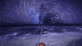 a person in a video game is standing in the ocean