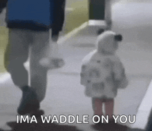 a man and a little girl are walking down a sidewalk with the words ima waddle on you above them .
