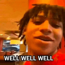 a close up of a person 's face with the words `` well well well '' on it .