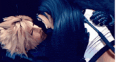 a man and a woman are kissing each other in a dark room .