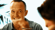 a man says it sounds weird while smiling at another man