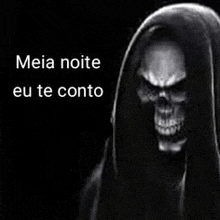 a black and white photo of a grim reaper with a hood and a skull .