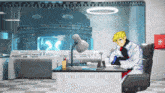 a man sits at a desk in a room with a lamp and a red box that says bb